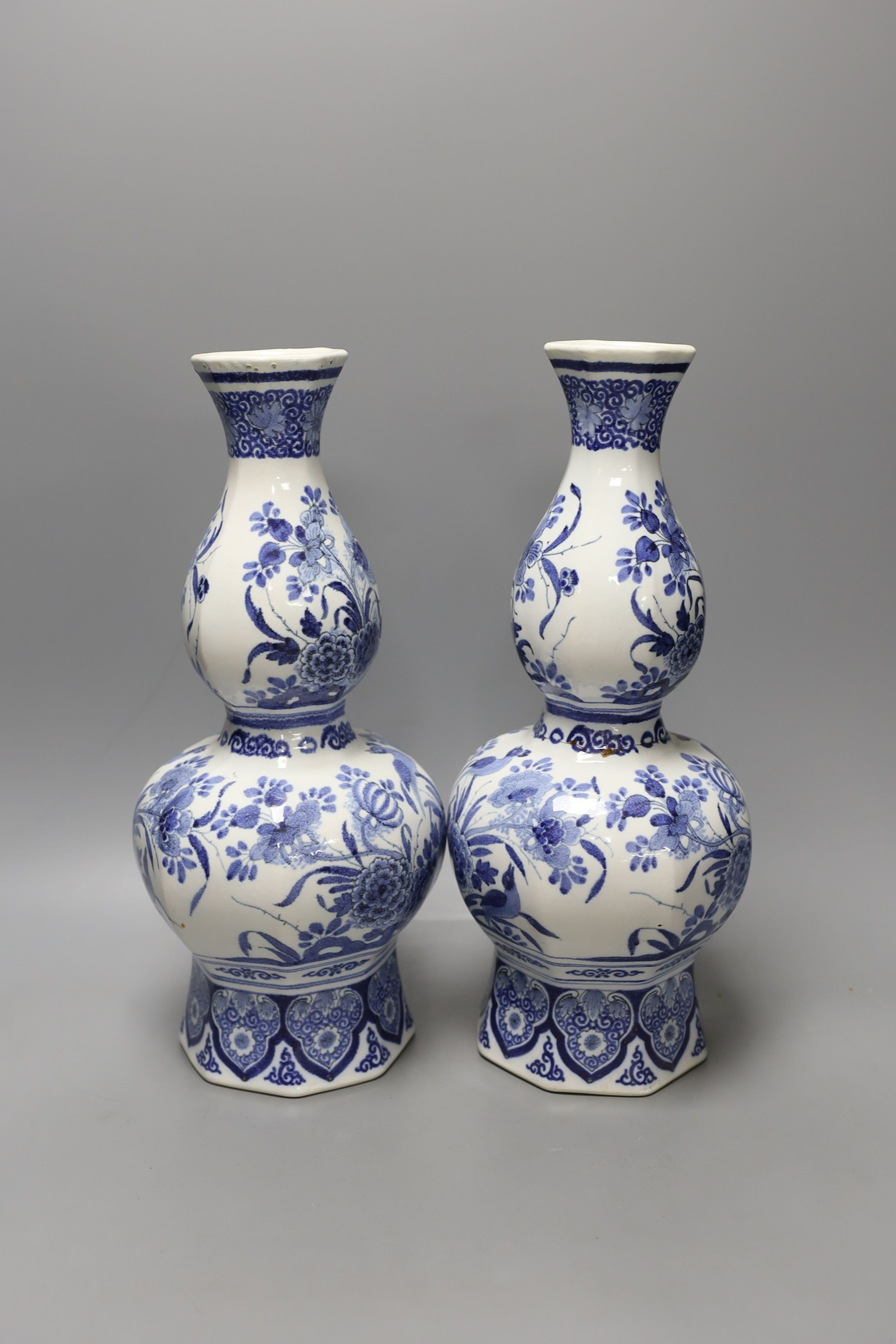 A pair of 19th century Dutch Delft vases - 33.5cm tall